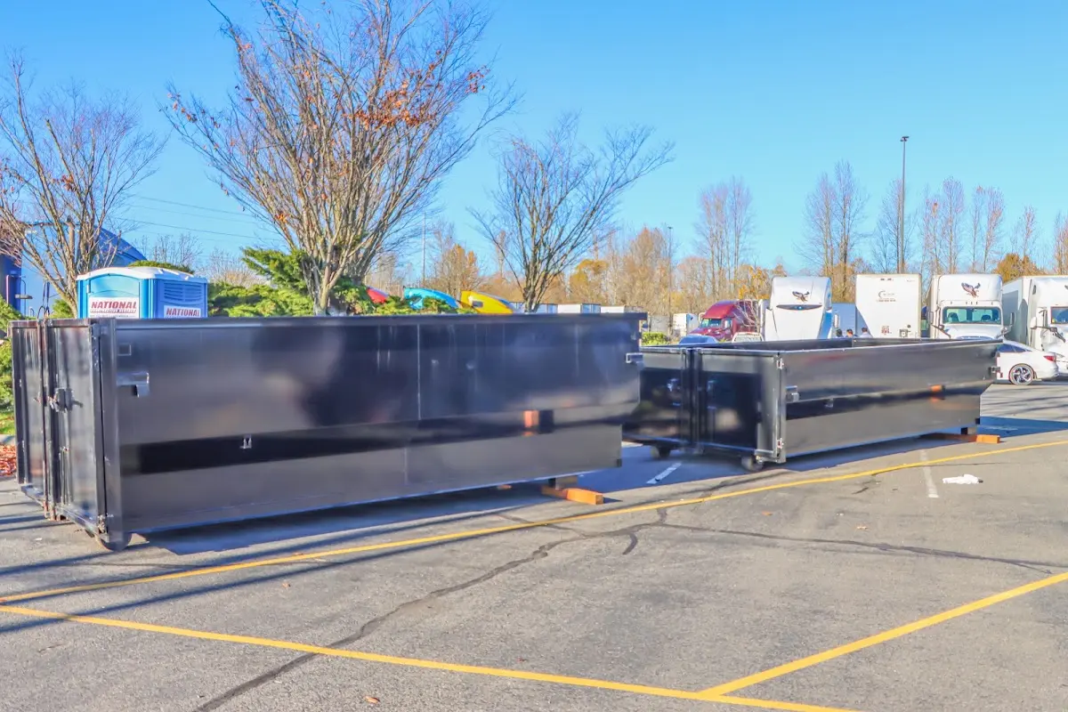 Professional dumpster rental service with roll-off container on residential driveway in Santa Clara